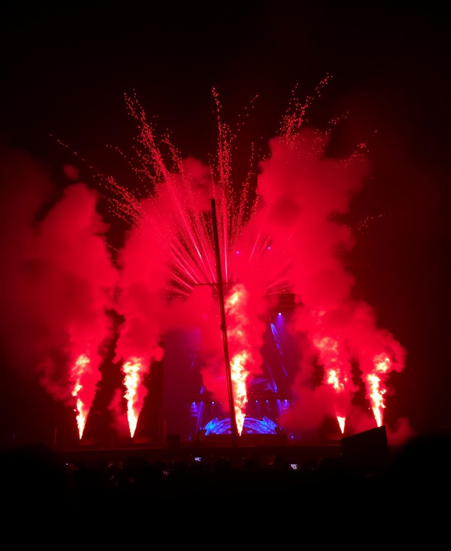 Pyrotechnic flame jets on a dark stage